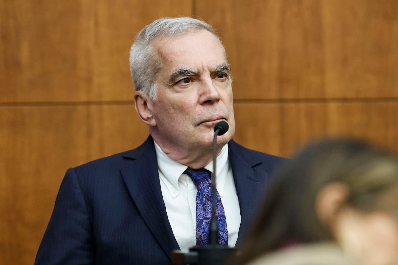 default-173 Elderly man in formal attire providing testimony in court